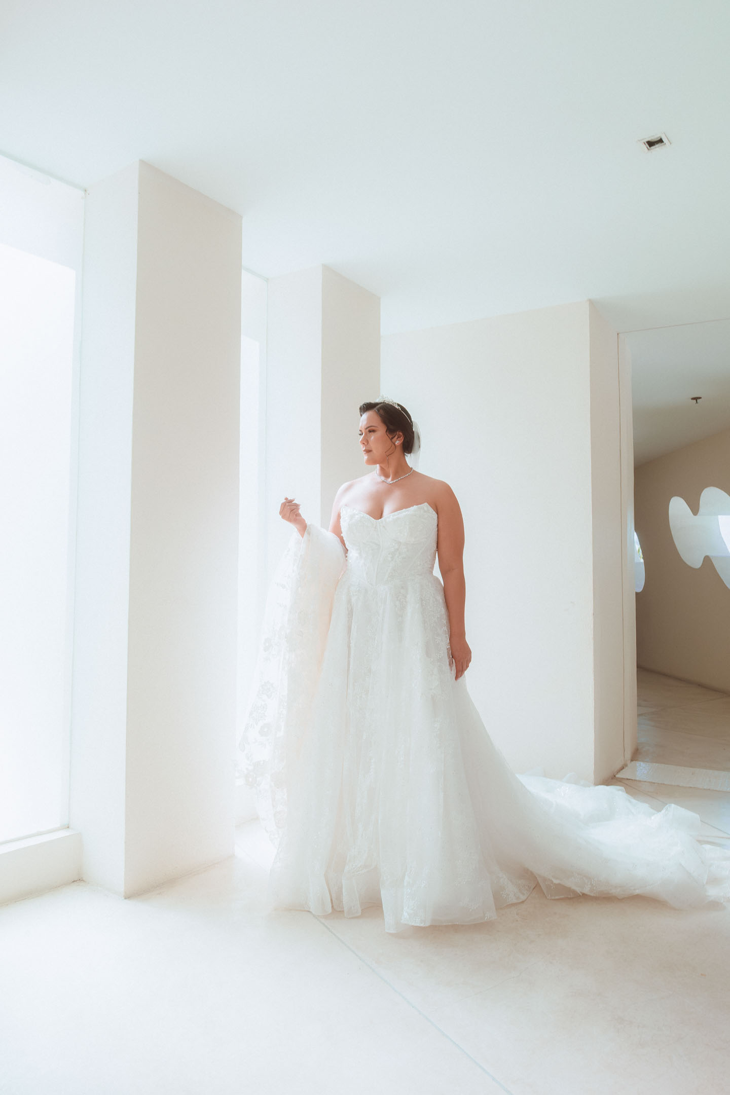 Bride getting ready in a sunlit Puerto Vallarta suite